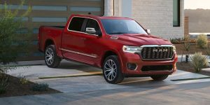 Red RAM pickup truck in driveway